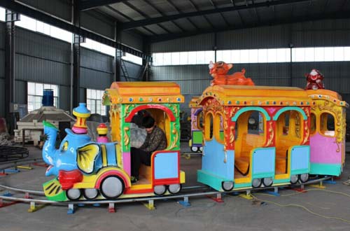 kids ride on train with track